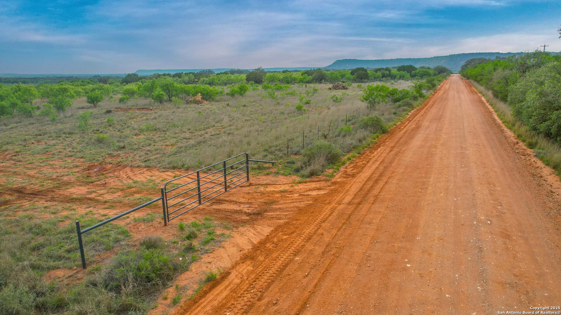 a view of a lake with a yard
