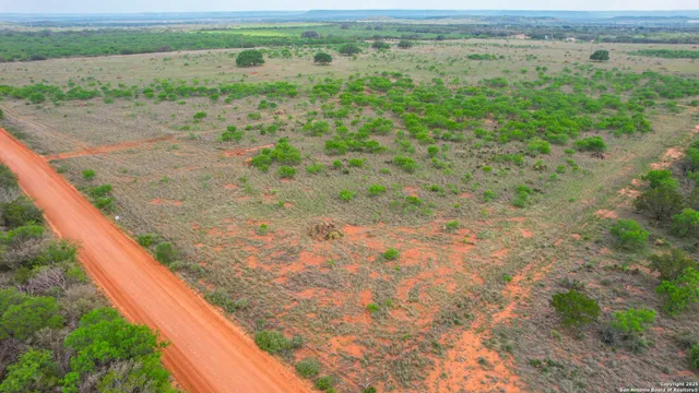 a view of a field with an outdoor space