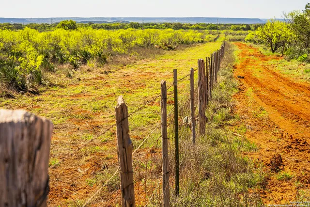 a view of a swimming pool with an outdoor space and seating area