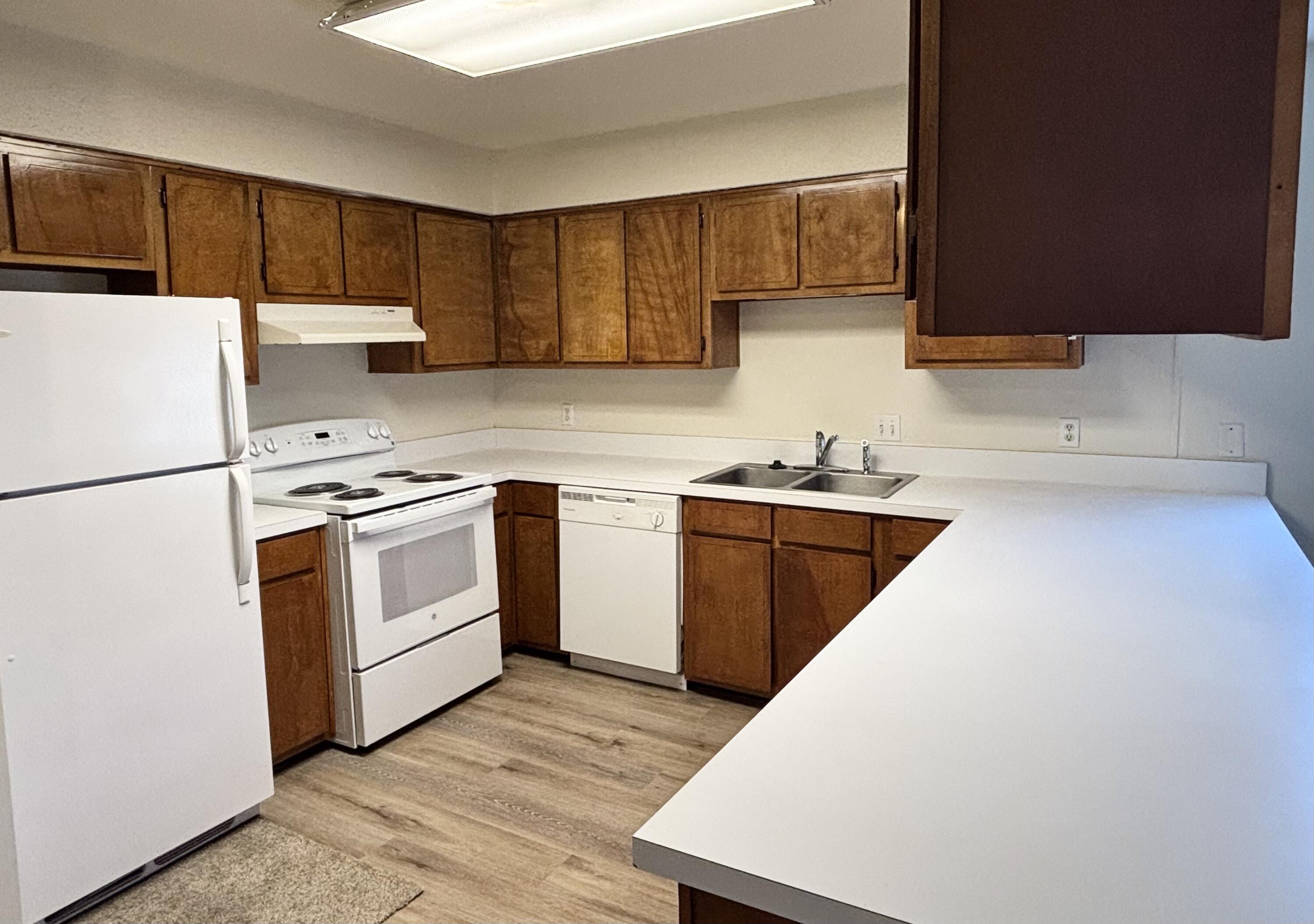 337 Lewis Street, Unit B Fort Walton Beach, FL 32547 - Photo 4 of 8 a kitchen with a sink a stove and refrigerator