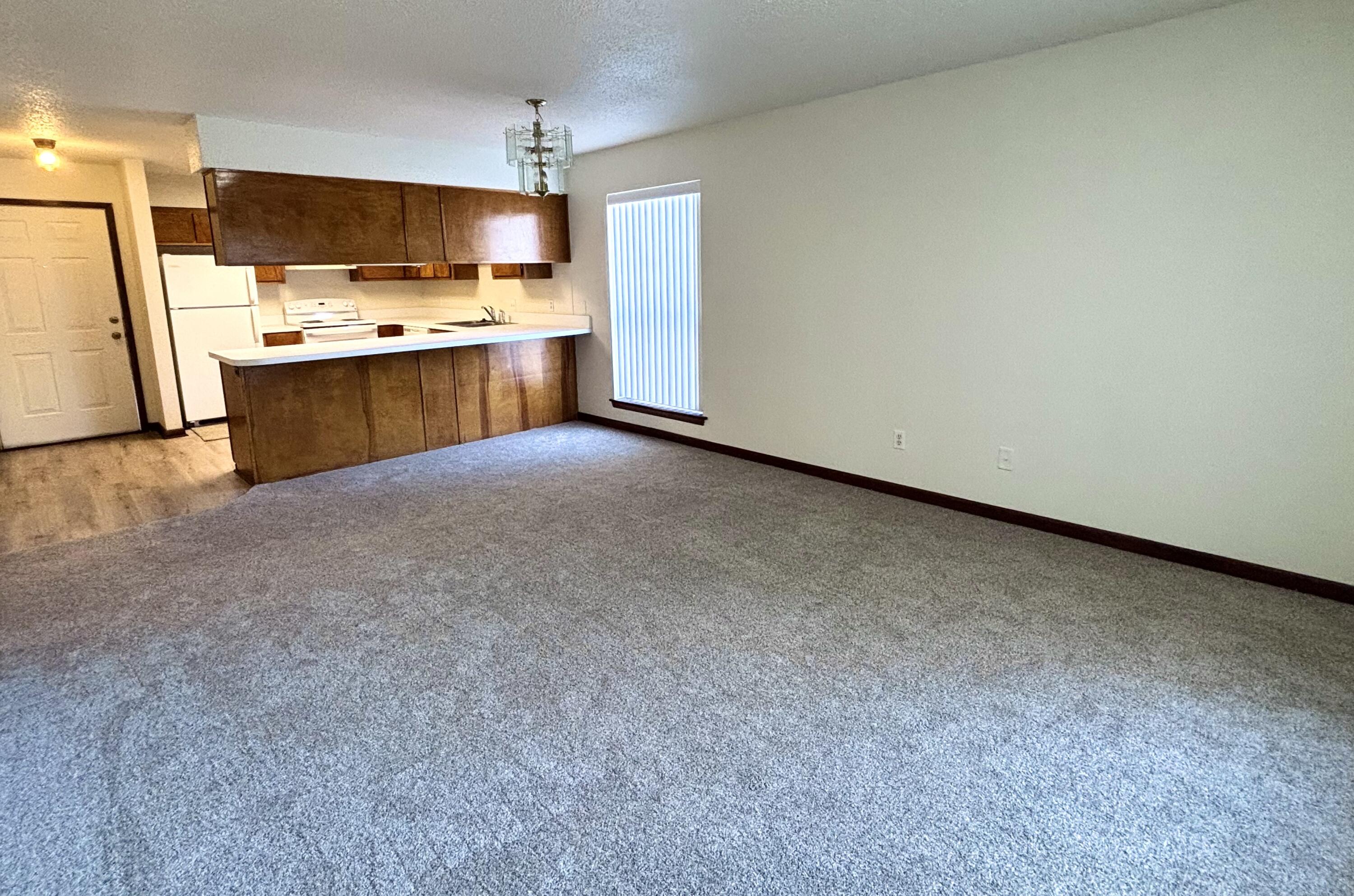 337 Lewis Street, Unit B Fort Walton Beach, FL 32547 - Photo 5 of 8 a view of a kitchen with a sink and a refrigerator