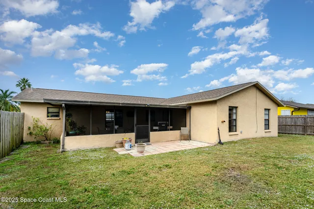 a front view of house with a garden