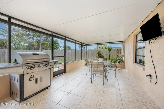 a kitchen with a stove a sink and a refrigerator