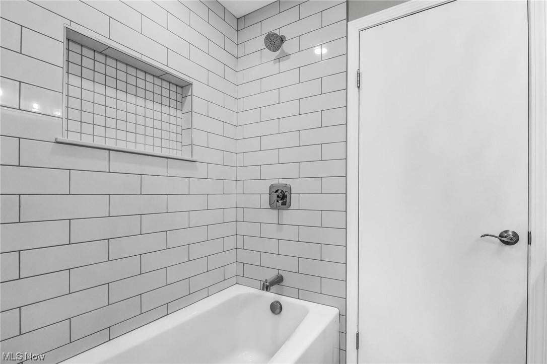 18230 Egbert Road Walton Hills, OH 44146 - Photo 20 of 34 Main Bathroom featuring tiled tub and shower