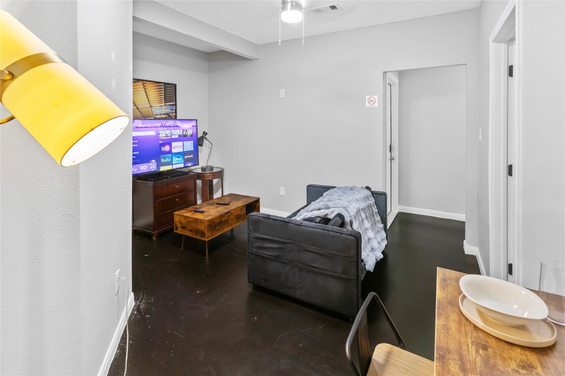 2824 Blodgett Street, Unit 2 Houston, TX 77004 - Photo 12 of 25 a living room with furniture and a mirror