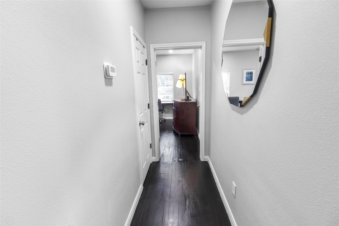 2824 Blodgett Street, Unit 2 Houston, TX 77004 - Photo 19 of 25 a view of a hallway with wooden floor and staircase