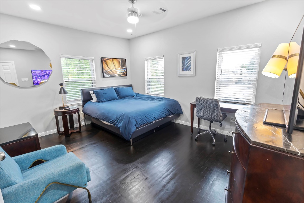 2824 Blodgett Street, Unit 2 Houston, TX 77004 - Photo 20 of 25 a bedroom with a bed a couch and dresser