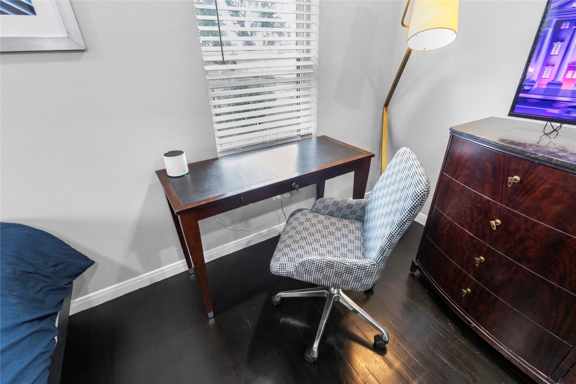 2824 Blodgett Street, Unit 2 Houston, TX 77004 - Photo 22 of 25 a view of a workspace with furniture and wooden floor