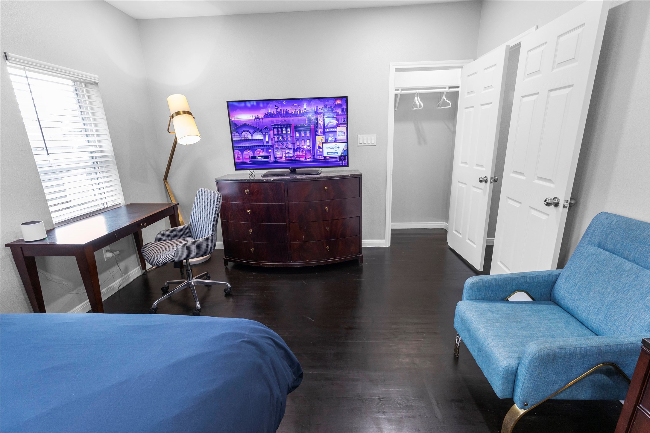 2824 Blodgett Street, Unit 2 Houston, TX 77004 - Photo 23 of 25 a living room with furniture and a flat screen tv