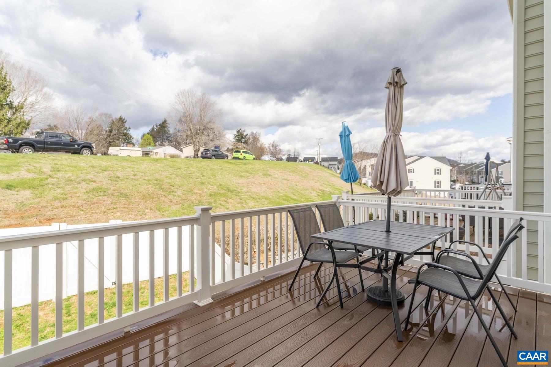 2052 Elm Tree Court Charlottesville, VA 22911 - Photo 12 of 26 a view of a balcony with chair and wooden floor