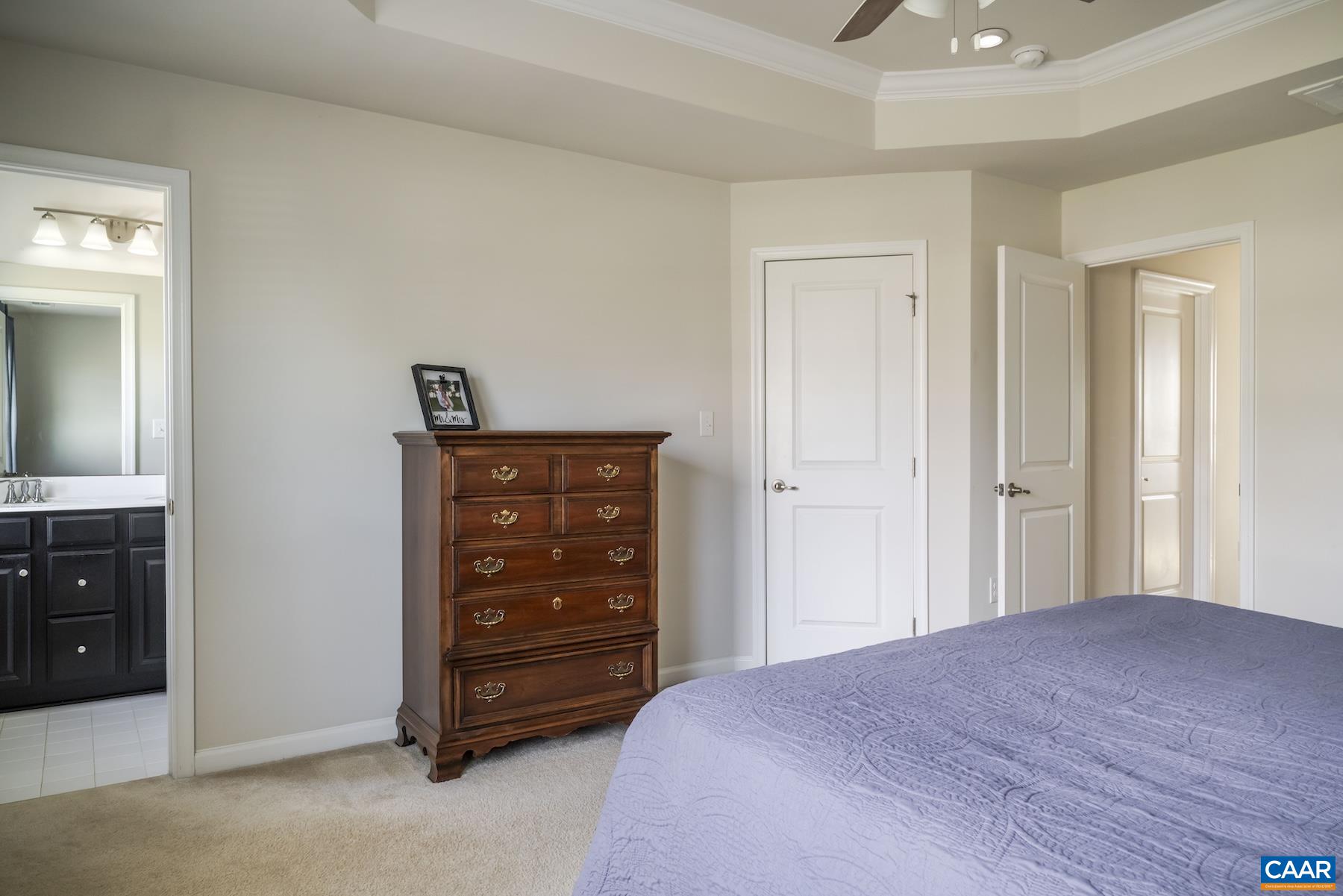 2052 Elm Tree Court Charlottesville, VA 22911 - Photo 14 of 26 a bedroom with a bed and a dresser