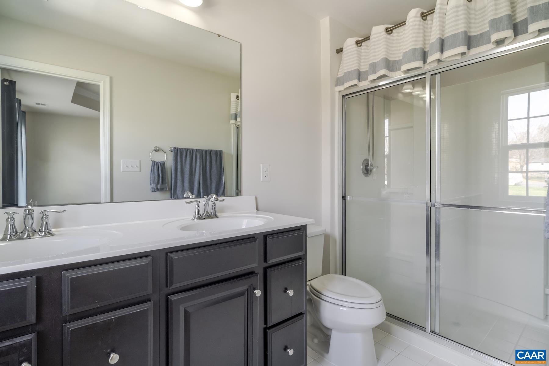 2052 Elm Tree Court Charlottesville, VA 22911 - Photo 15 of 26 a bathroom with a sink toilet and shower