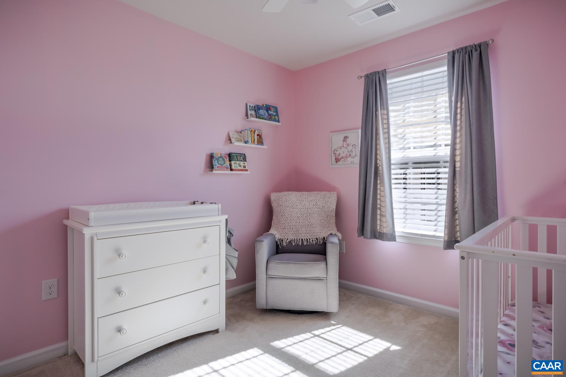 2052 Elm Tree Court Charlottesville, VA 22911 - Photo 16 of 26 a bedroom with a bed and a chair