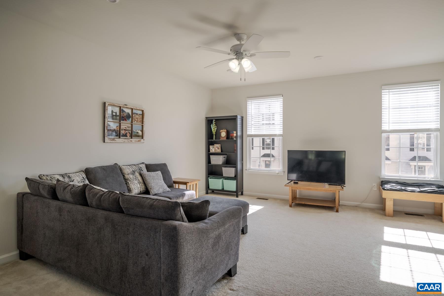 2052 Elm Tree Court Charlottesville, VA 22911 - Photo 3 of 26 a living room with furniture and a flat screen tv