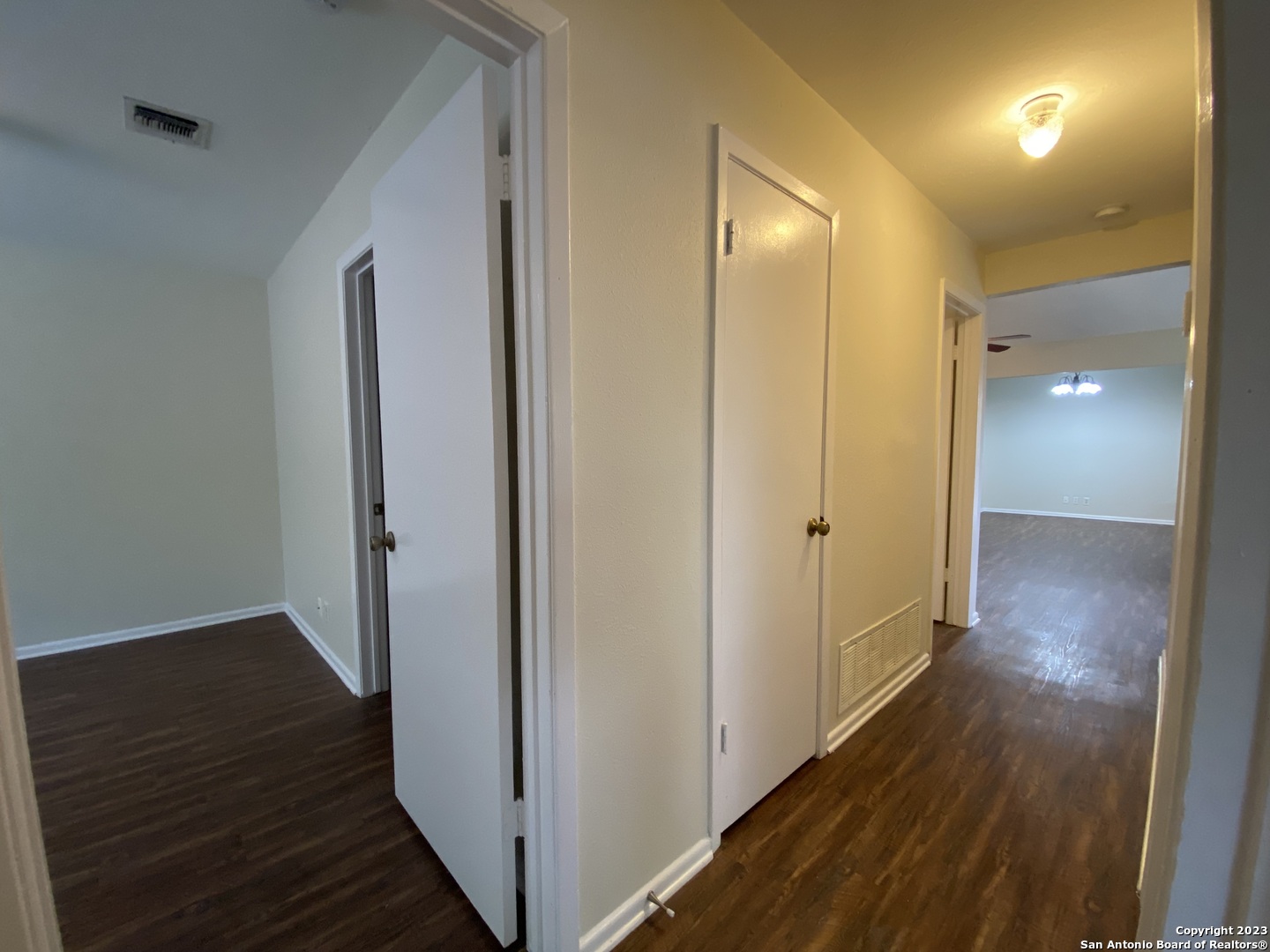 7214 Rimwood Street Live Oak, TX 78233 - Photo 12 of 24 a view of a hallway with wooden floor