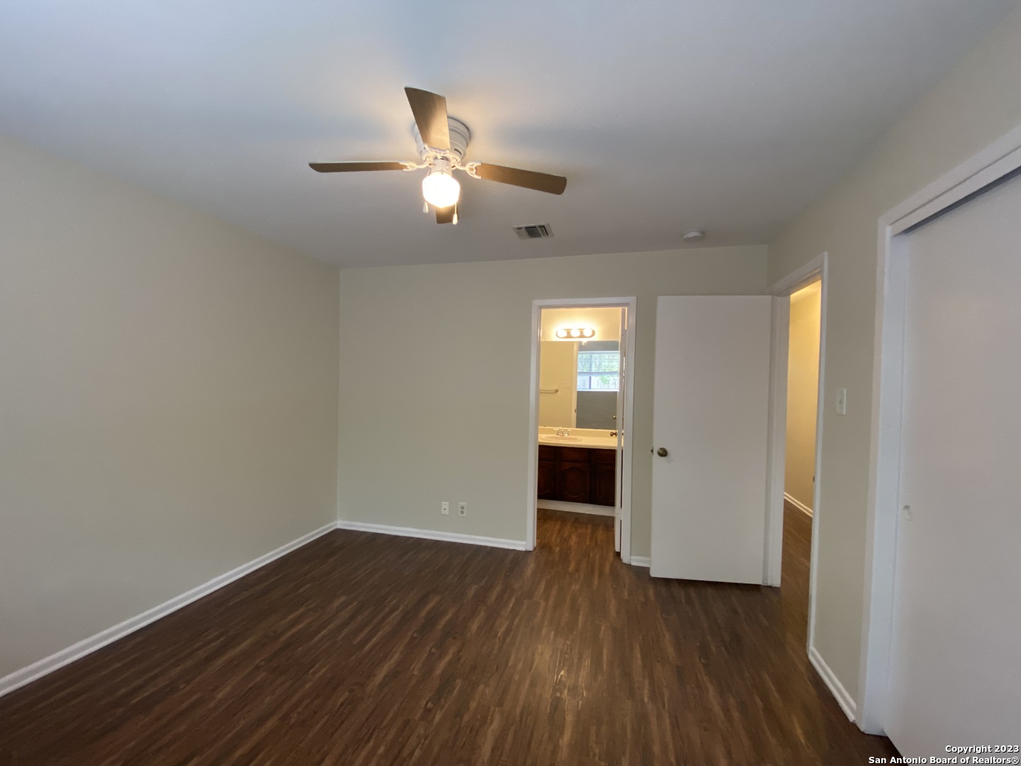 7214 Rimwood Street Live Oak, TX 78233 - Photo 13 of 24 a view of empty room with wooden floor and fan