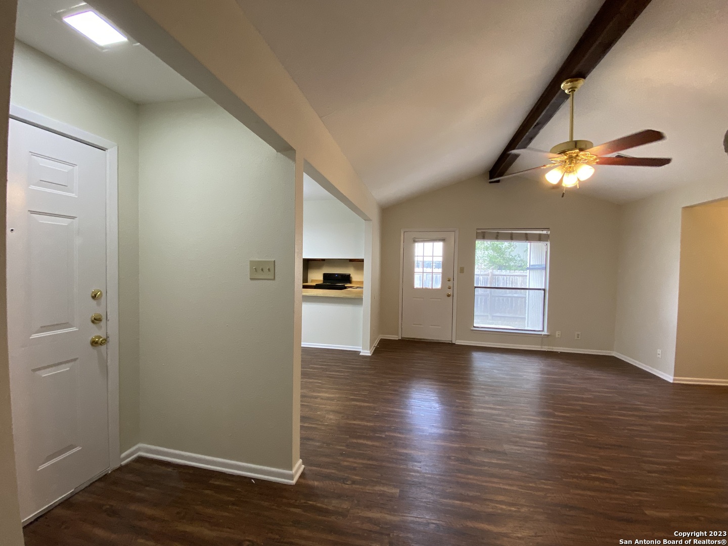 7214 Rimwood Street Live Oak, TX 78233 - Photo 3 of 24 an empty room with wooden floor and windows