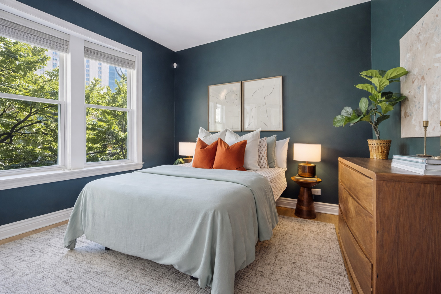 2547 North Clark Street, Unit 2N Chicago, IL 60614 - Photo 13 of 25 a bedroom with a bed running cycle and a window