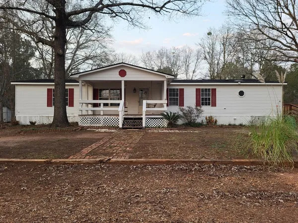 a front view of a house with parking yard