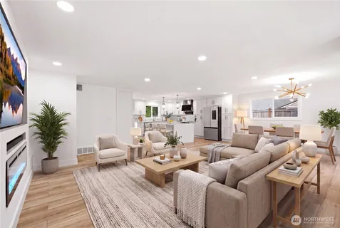 a living room with furniture wooden floor and a fireplace