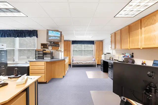 a kitchen that has a sink and a stove in it