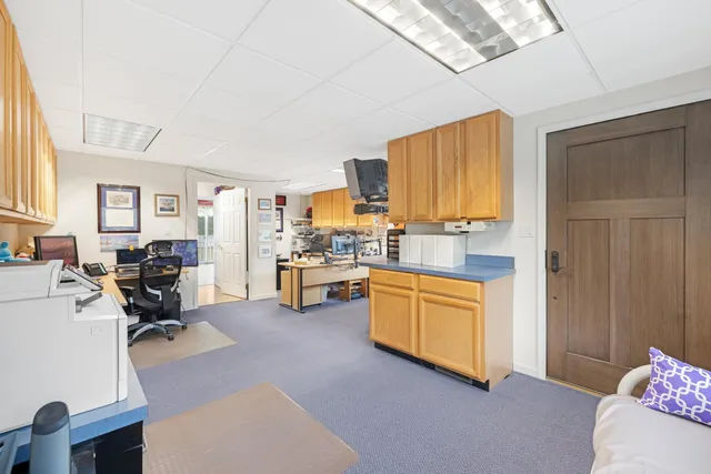 a view of a kitchen with workspace and a window