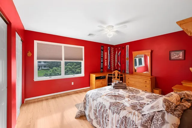 a bed room with a bed and a window