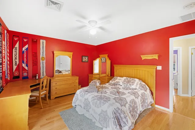 a bed room with a bed and a mirror