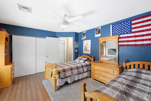 a bedroom with bed and a window