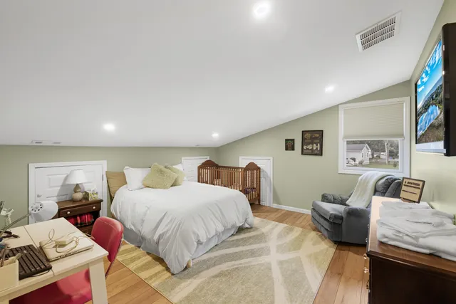 a bedroom with a bed and a couch