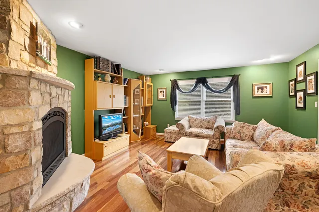 a bedroom with furniture and a fireplace