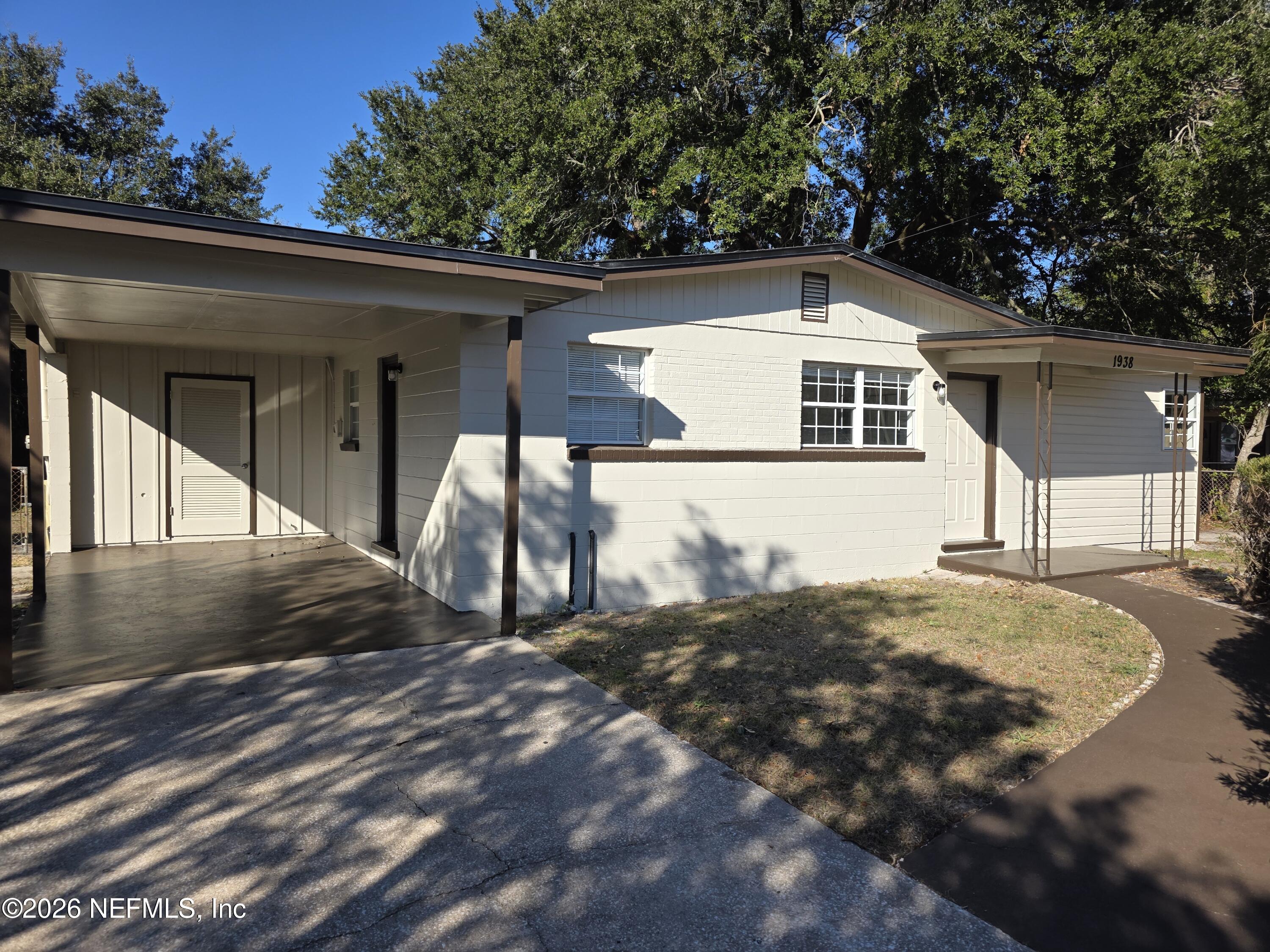 1938 Leon Road Jacksonville, FL 32246 - Photo 1 of 10 a view of a small house with a yard