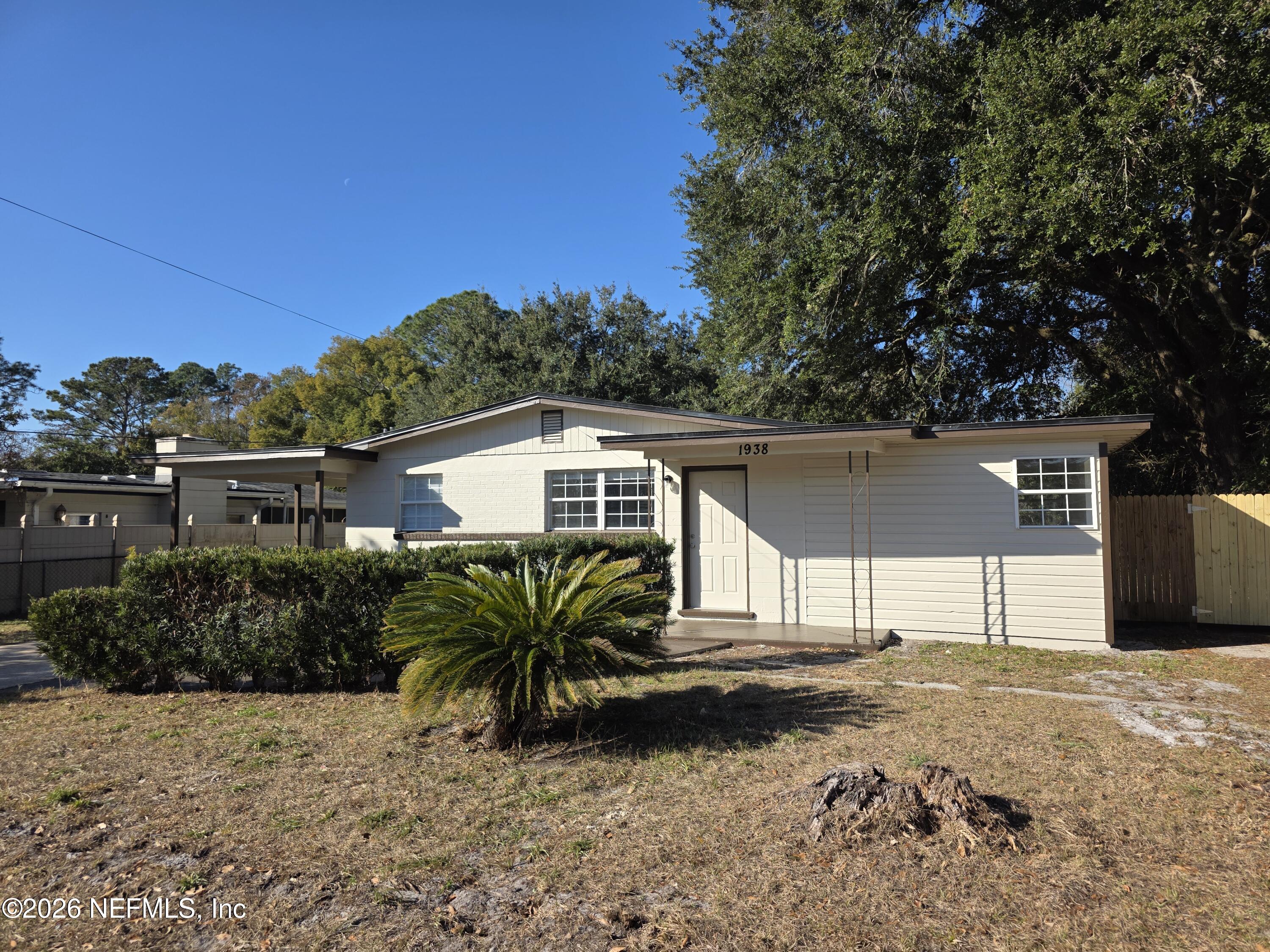 1938 Leon Road Jacksonville, FL 32246 - Photo 2 of 10 a front view of a house with a yard