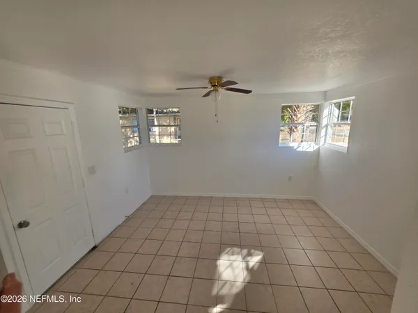 a view of an empty room and window
