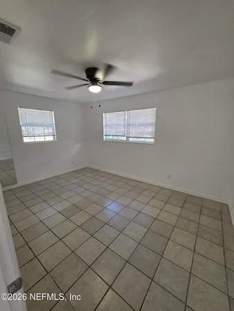 a view of an empty room and window