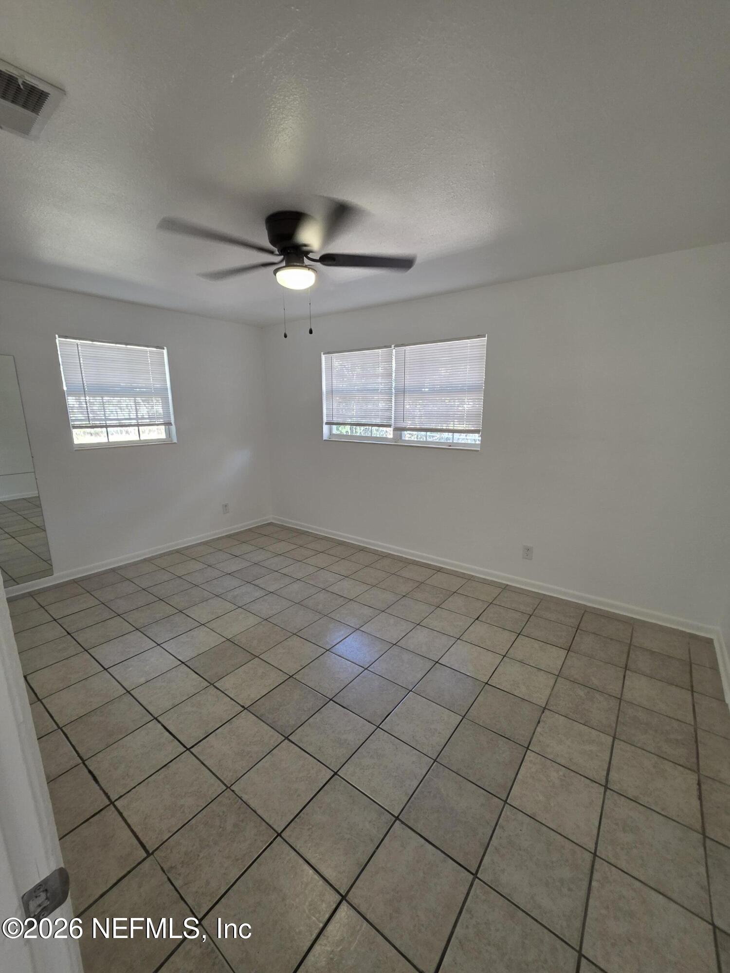 1938 Leon Road Jacksonville, FL 32246 - Photo 5 of 10 a view of an empty room and window