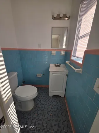 a bathroom with a toilet and a sink