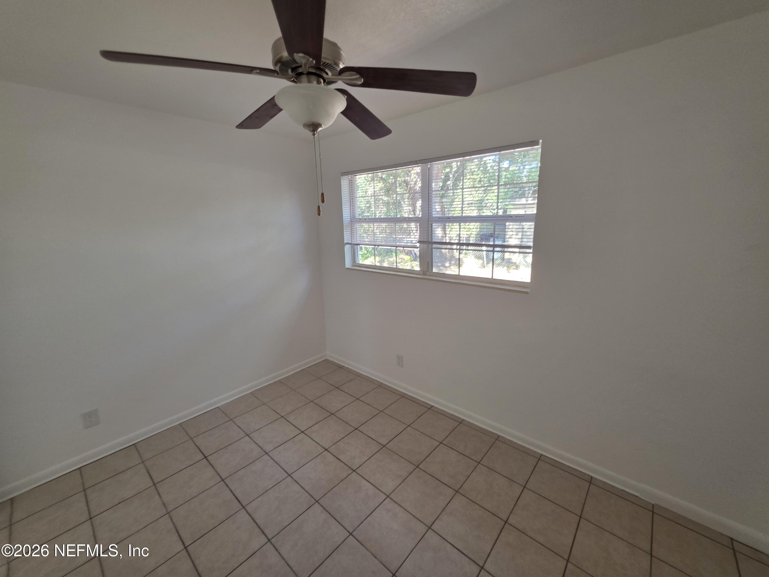 1938 Leon Road Jacksonville, FL 32246 - Photo 7 of 10 a view of an empty room and window