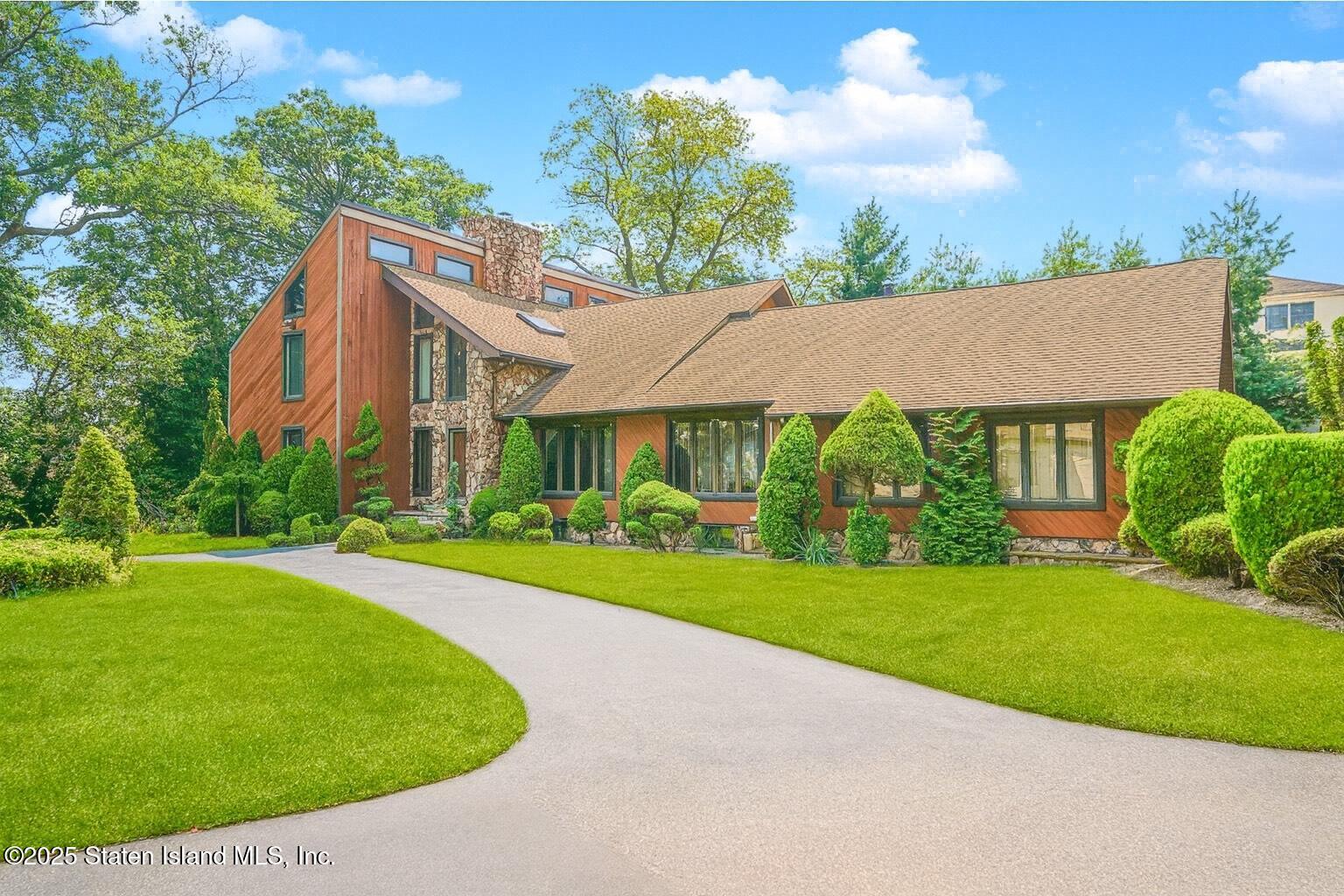 30 Paradise Place Staten Island, NY 10307 - Photo 1 of 15 a view of a house with a big yard plants and large trees