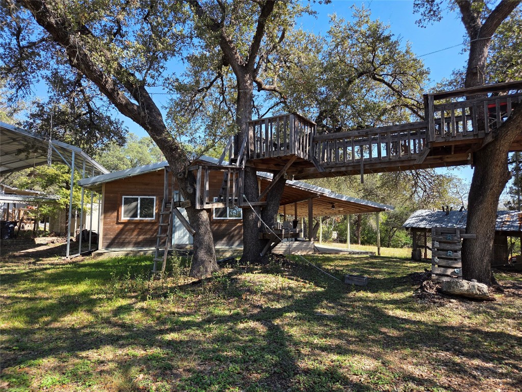 9815 Trails End Road Leander, TX 78641 - Photo 1 of 1 a view of a park that has large trees and a large tree