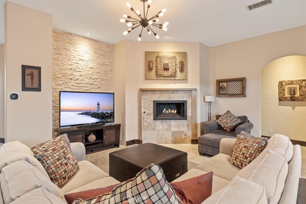 35678 Tranquil Place Cathedral City, CA 92234 - Photo 11 of 75 a living room with furniture and a fireplace