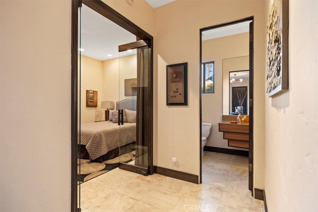35678 Tranquil Place Cathedral City, CA 92234 - Photo 22 of 75 a view of a bedroom with a bed and glass door