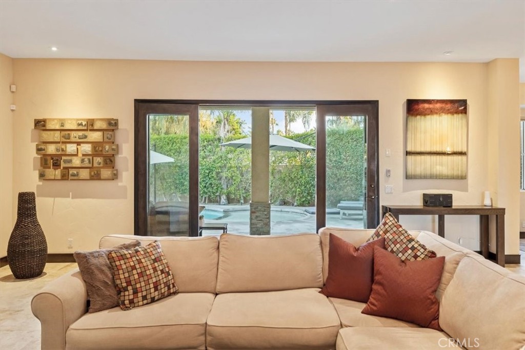 35678 Tranquil Place Cathedral City, CA 92234 - Photo 30 of 75 a living room with furniture and a large window