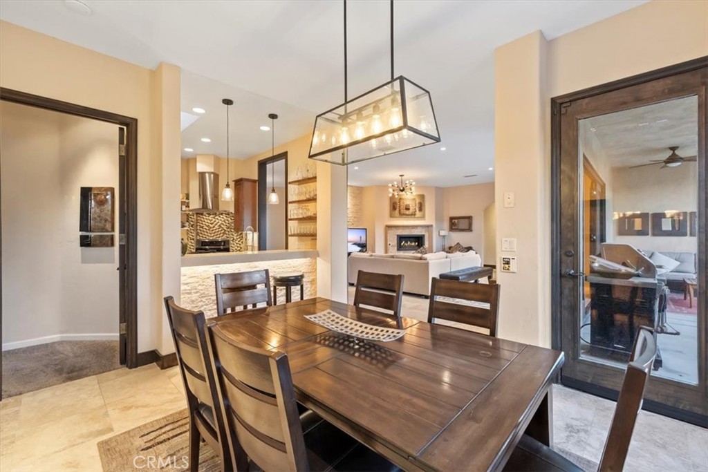 35678 Tranquil Place Cathedral City, CA 92234 - Photo 38 of 75 a view of a dining room and livingroom with furniture wooden floor a chandelier