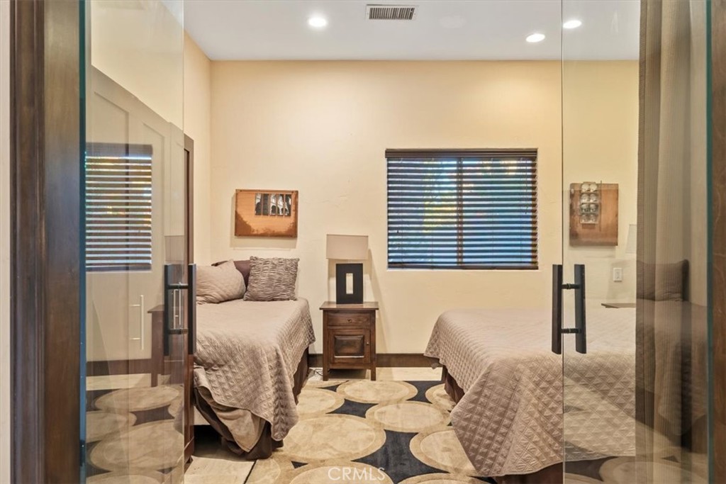 35678 Tranquil Place Cathedral City, CA 92234 - Photo 40 of 75 a bedroom with furniture and a large window