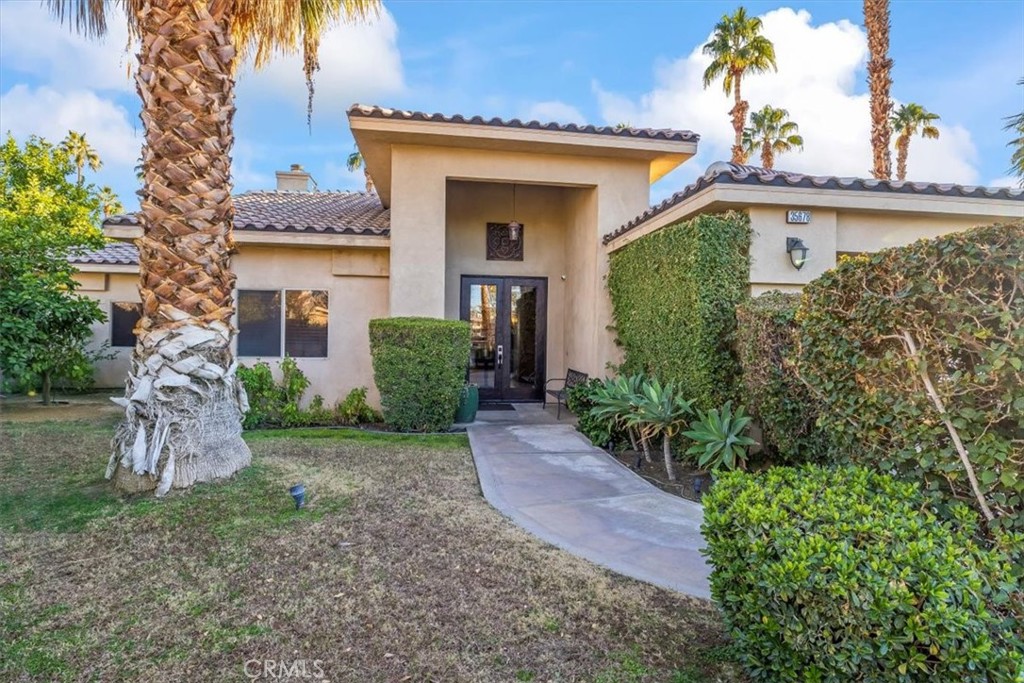 35678 Tranquil Place Cathedral City, CA 92234 - Photo 4 of 75 front view of a house with a pathway