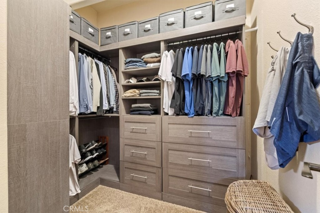 35678 Tranquil Place Cathedral City, CA 92234 - Photo 48 of 75 a view of walk in closet with clothes and shoes