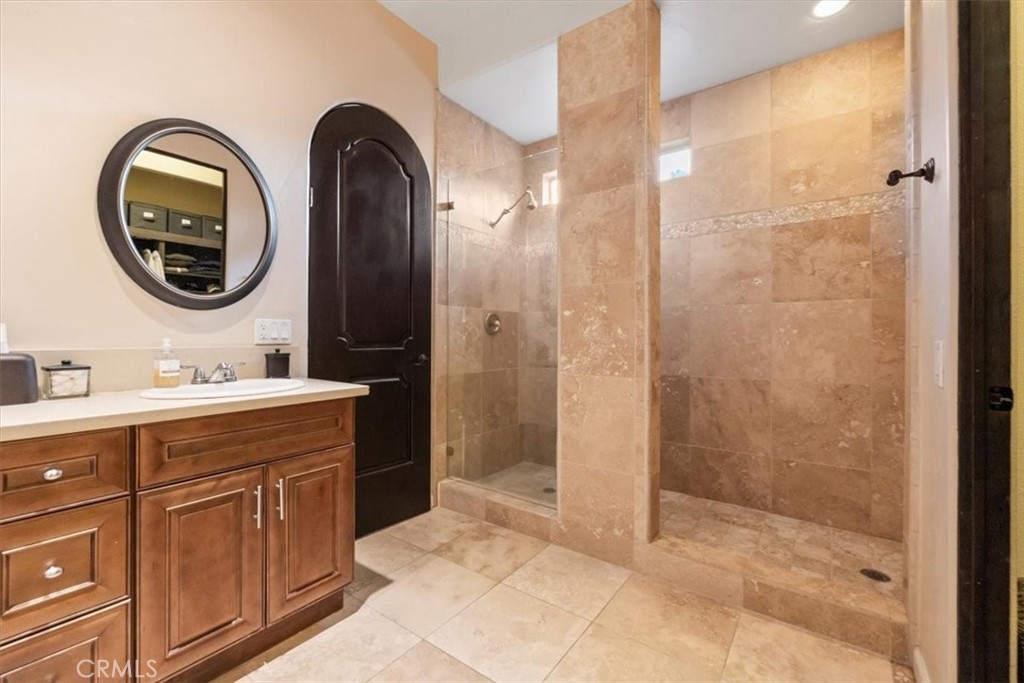 35678 Tranquil Place Cathedral City, CA 92234 - Photo 49 of 75 a bathroom with a sink and a mirror