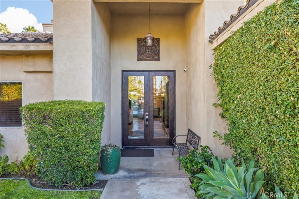 35678 Tranquil Place Cathedral City, CA 92234 - Photo 5 of 75 a front view of a house with a yard