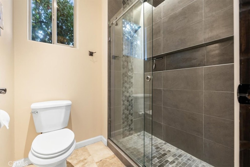 35678 Tranquil Place Cathedral City, CA 92234 - Photo 56 of 75 a white toilet sitting next to a bathroom sink